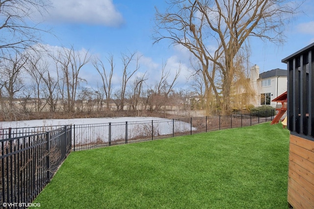 view of yard with a fenced backyard and a playground