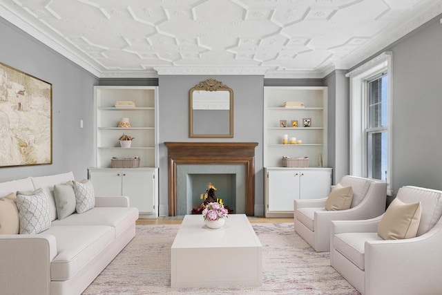 living room with crown molding and built in shelves