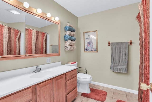 full bath with baseboards, toilet, vanity, and tile patterned floors