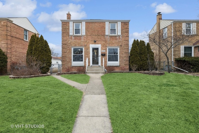 view of front of home with fence, a front lawn, and brick siding