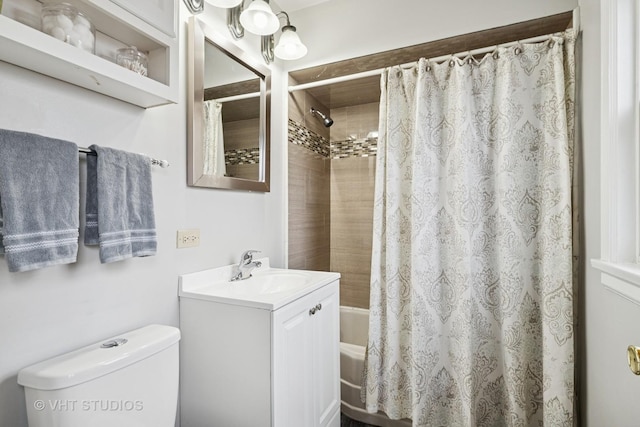 bathroom with toilet, shower / tub combo, and vanity