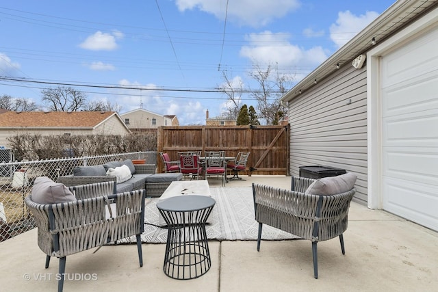 view of patio / terrace featuring outdoor dining area, fence, and an outdoor living space