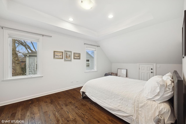 bedroom with dark wood-style floors, recessed lighting, vaulted ceiling, and baseboards