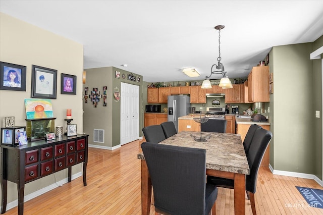 dining space featuring light hardwood / wood-style flooring