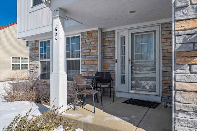 doorway to property with a patio area