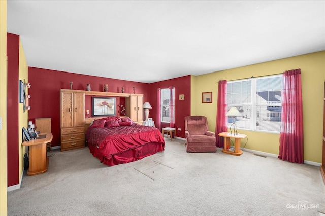 bedroom with light colored carpet