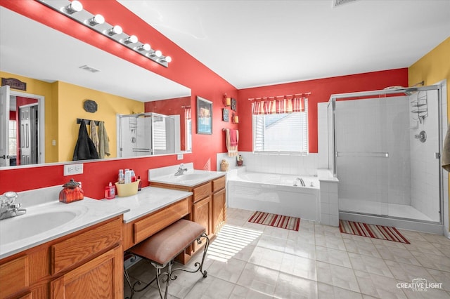 bathroom with separate shower and tub and vanity