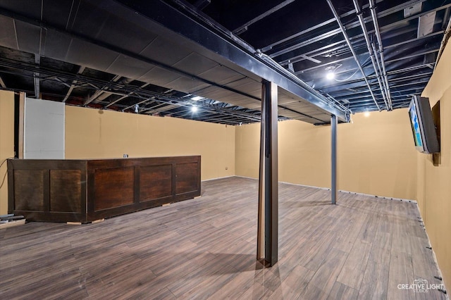 basement featuring hardwood / wood-style flooring