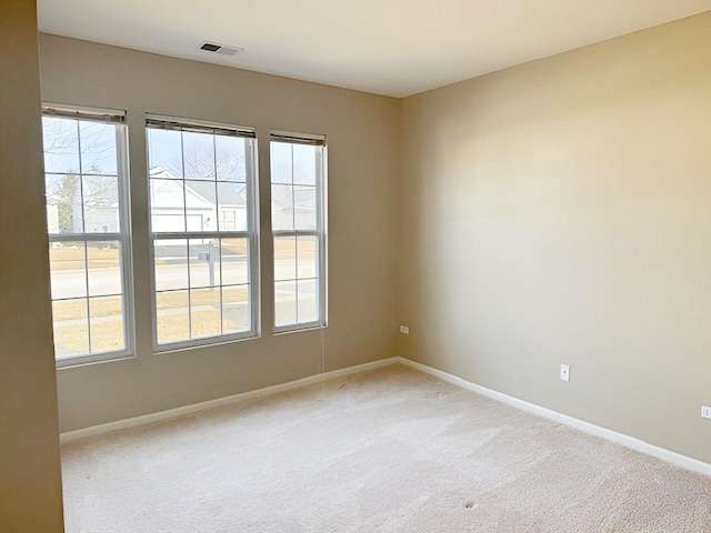 spare room with carpet floors