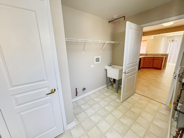 laundry area with washer hookup, sink, and gas dryer hookup