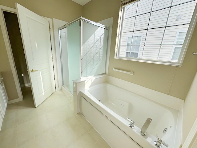 bathroom with separate shower and tub