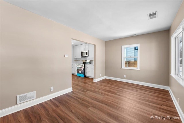 empty room with wood-type flooring