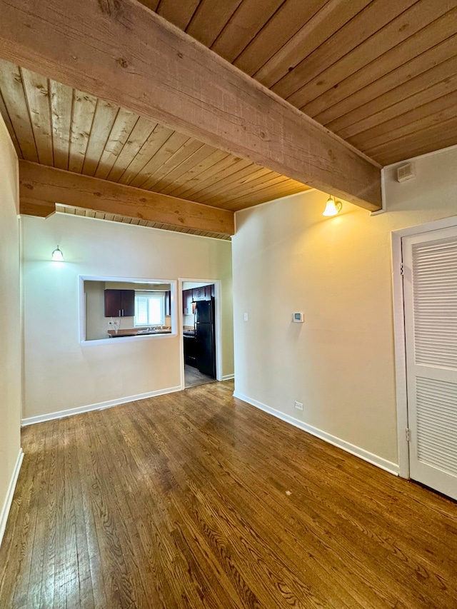 15126 S Sunset Dr, Dolton, IL 60419 - unfurnished living room with wood ceiling, beamed ceiling, baseboards, and wood finished floors