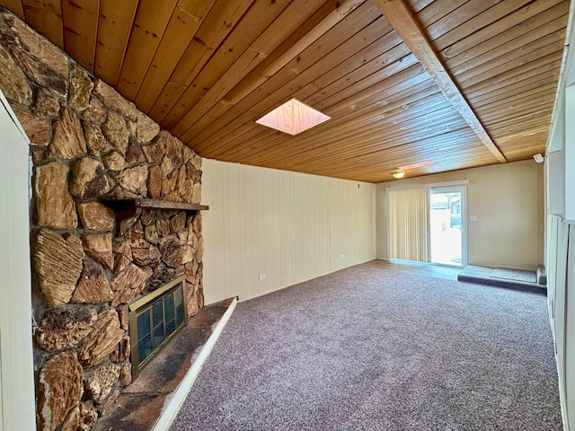15126 S Sunset Dr, Dolton, IL 60419 - unfurnished living room with wood ceiling, visible vents, dark carpet, and a stone fireplace
