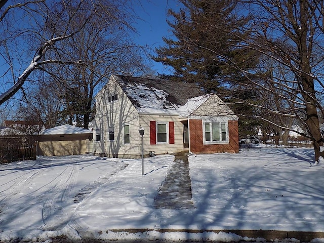 view of front of property with an outdoor structure and a garage