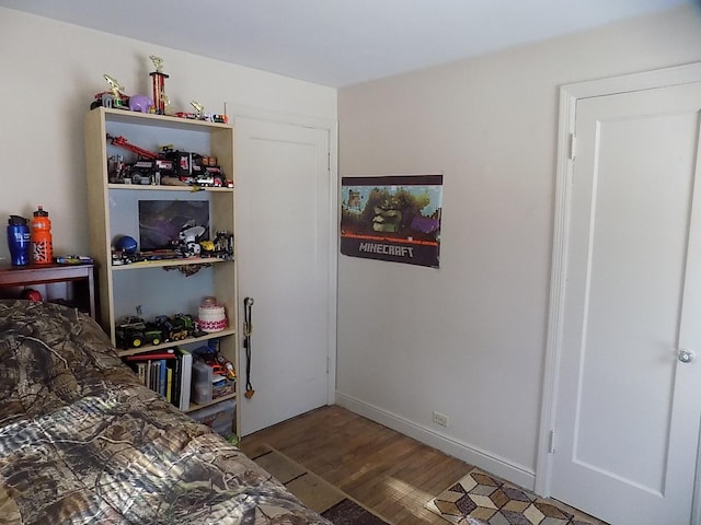 bedroom featuring dark hardwood / wood-style flooring