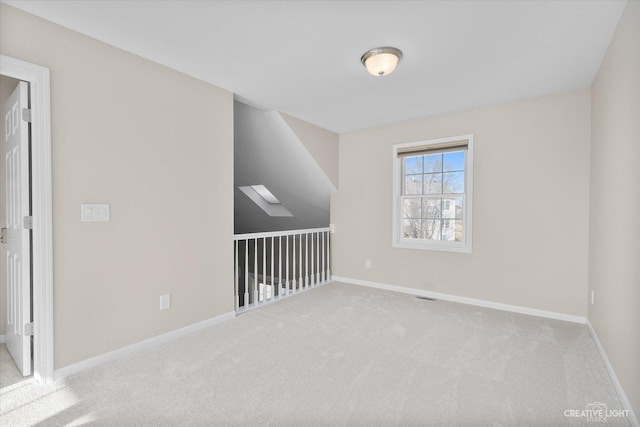 additional living space with carpet flooring, visible vents, and baseboards