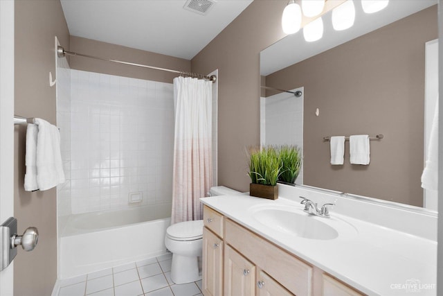 full bathroom featuring vanity, visible vents, tile patterned floors, toilet, and shower / tub combo with curtain