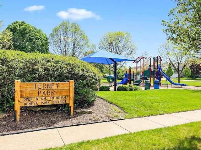 community jungle gym featuring a lawn