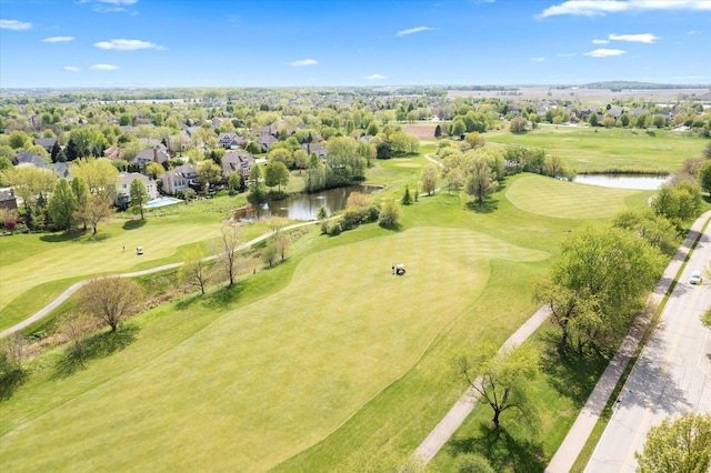 birds eye view of property featuring view of golf course and a water view