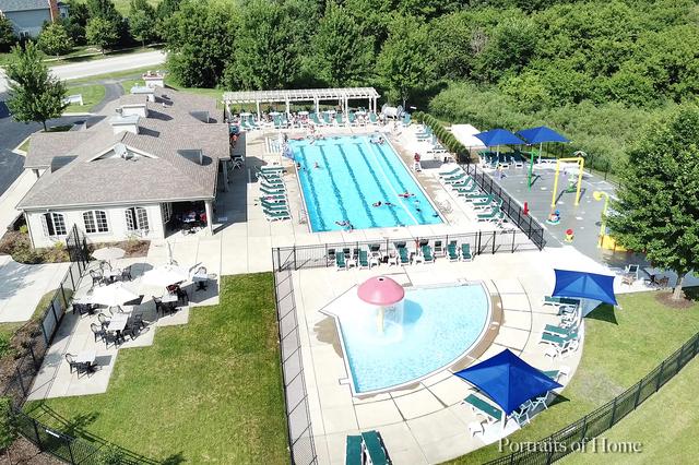 view of pool with a pergola, a yard, and fence