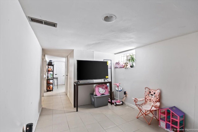 playroom featuring light tile patterned flooring, visible vents, and baseboards