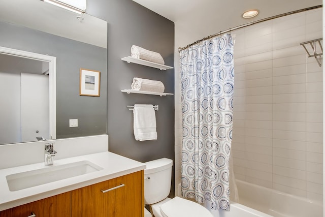 bathroom featuring shower / tub combo, vanity, and toilet