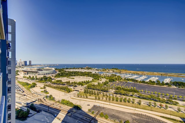 birds eye view of property featuring a view of city and a water view