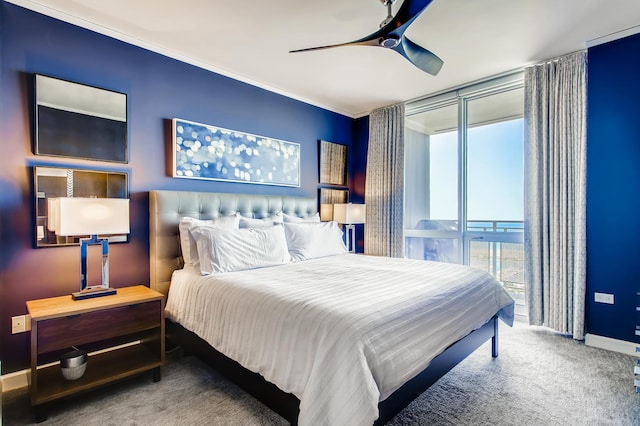 bedroom with baseboards, ceiling fan, access to exterior, a wall of windows, and carpet flooring