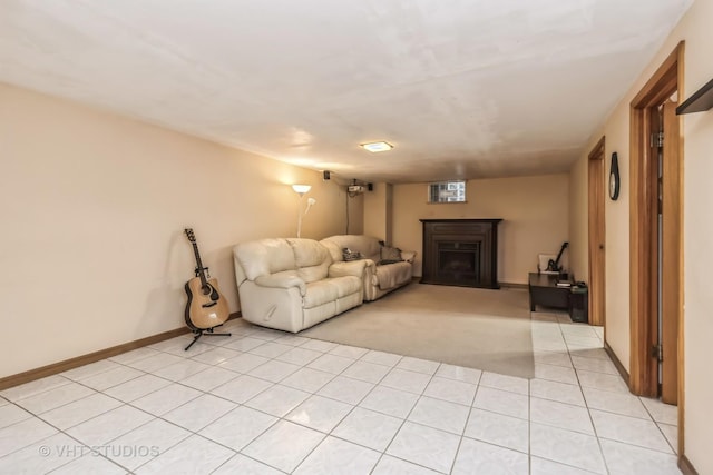 unfurnished living room featuring light carpet, light tile patterned floors, a fireplace, and baseboards