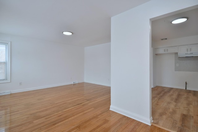 unfurnished room featuring light hardwood / wood-style flooring