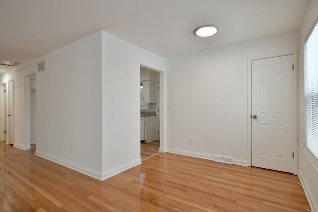 unfurnished room featuring light hardwood / wood-style flooring