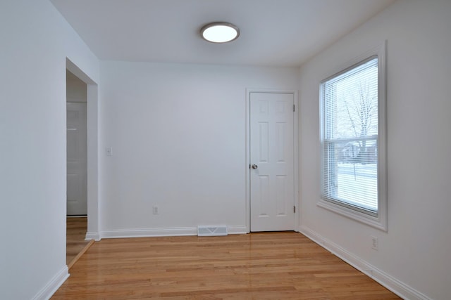 spare room featuring light hardwood / wood-style floors