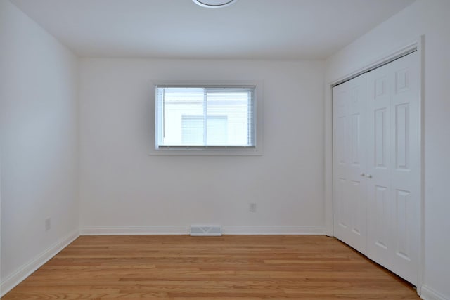 unfurnished bedroom featuring light hardwood / wood-style floors