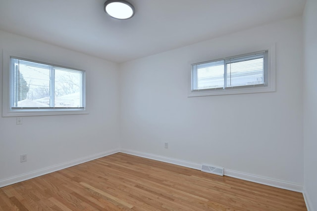 unfurnished room featuring light wood-type flooring