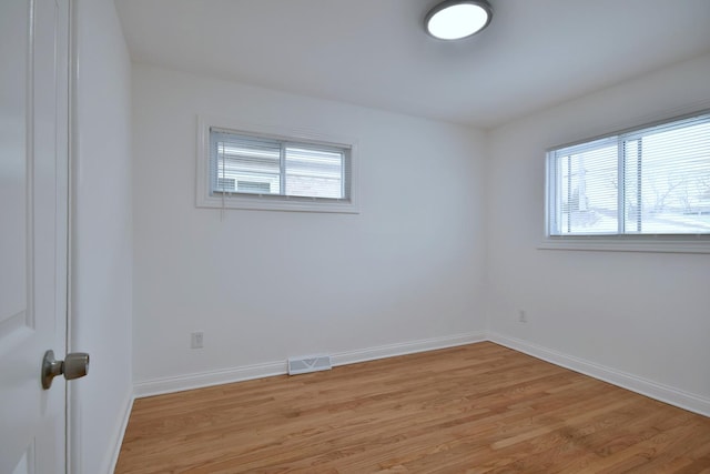 unfurnished room featuring light wood-type flooring