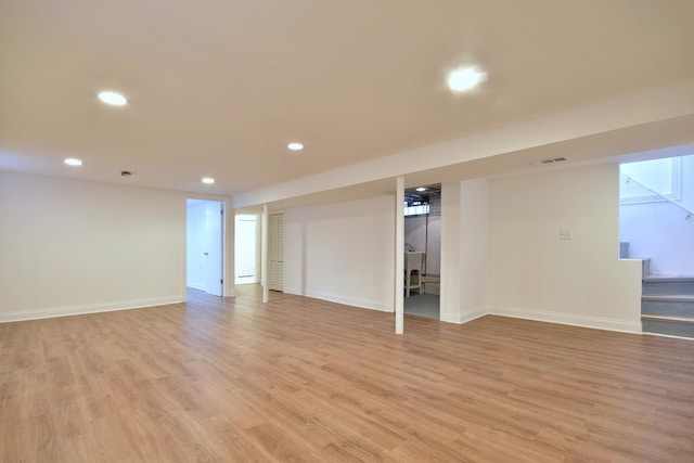 basement featuring light hardwood / wood-style floors