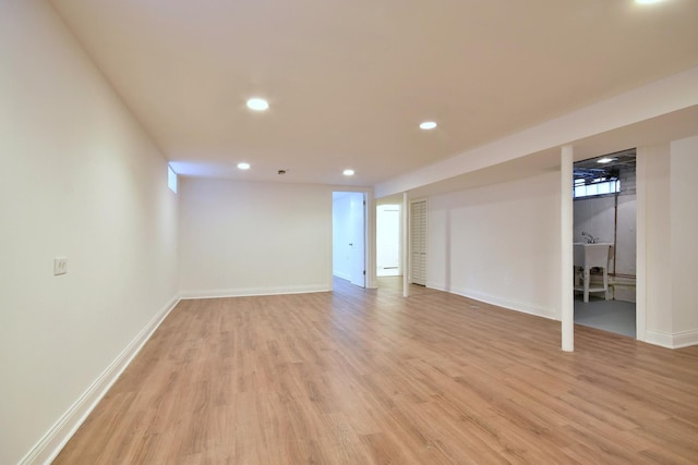 basement featuring light hardwood / wood-style floors