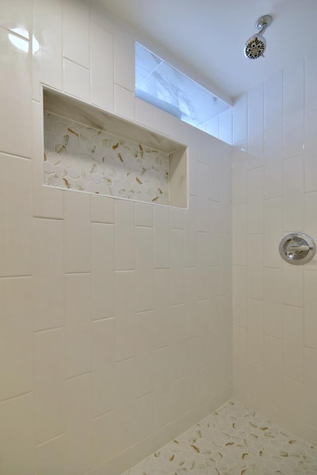 interior space featuring a tile shower