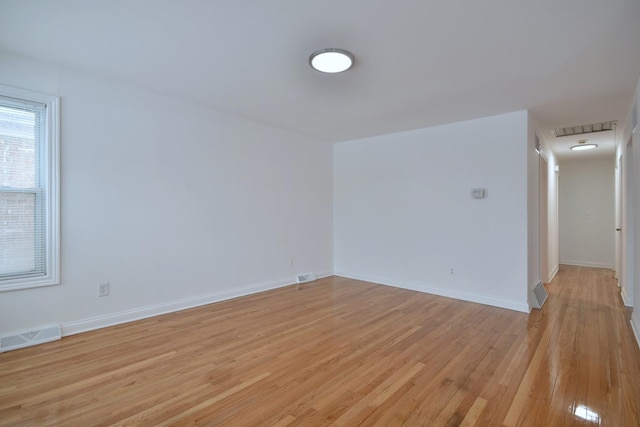 unfurnished room featuring light hardwood / wood-style flooring