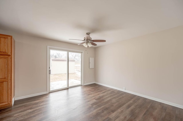 unfurnished room featuring ceiling fan, baseboards, and dark wood-type flooring