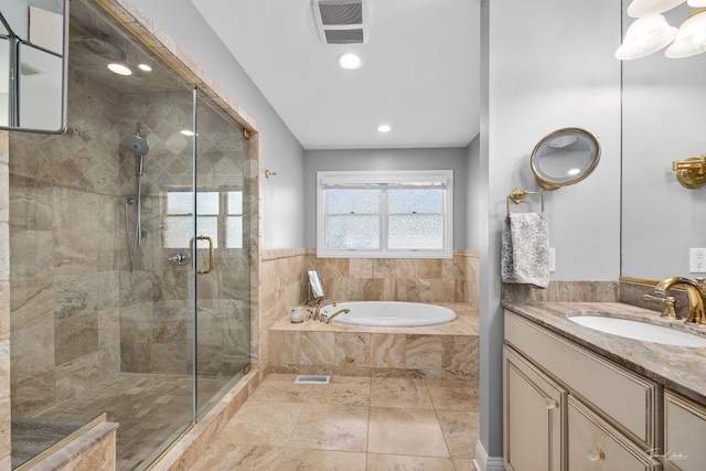 full bath with a stall shower, visible vents, vanity, a bath, and recessed lighting