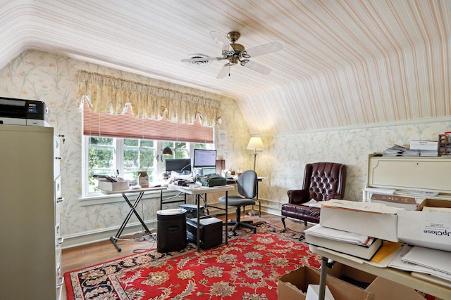 office featuring lofted ceiling, hardwood / wood-style floors, and ceiling fan