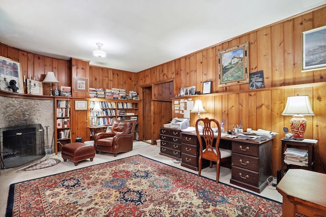 carpeted office with wood walls