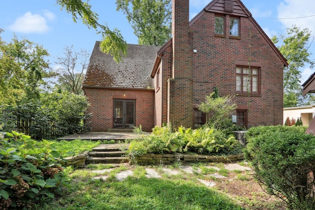 back of property featuring french doors and a patio