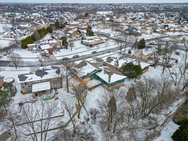 snowy aerial view with a residential view