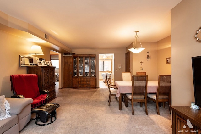 view of carpeted dining area