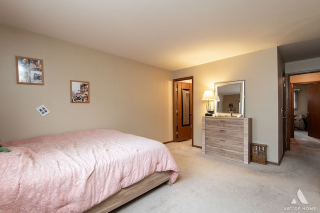 bedroom featuring light carpet