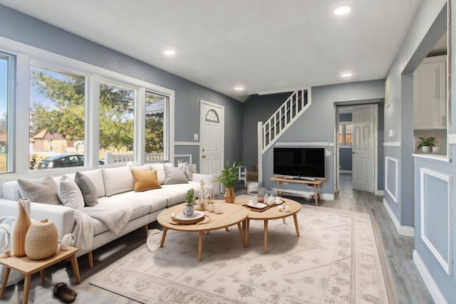 living room with light hardwood / wood-style flooring