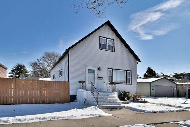 view of front of property with an outdoor structure and a garage